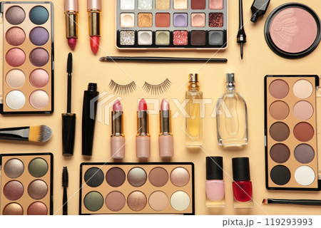 Different luxury makeup products on beige background, flat lay 119293993