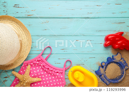 Summer beach toys with accessories on blue wooden background with copy space. Summer frame 119293996