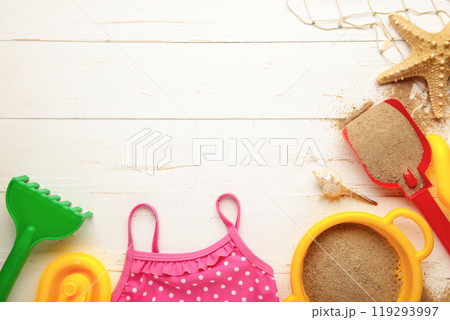 Summer beach toys with accessories on white background with copy space. Summer frame 119293997