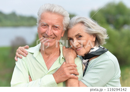 Portrait of beautiful senior couple posing in the park 119294142