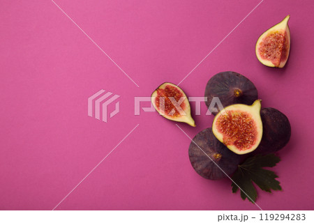 Fresh ripe figs on pink background. Tropical fruit 119294283