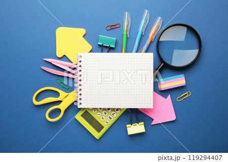 School supplies with notebook on blue background. Back to school. Flat lay. 119294407