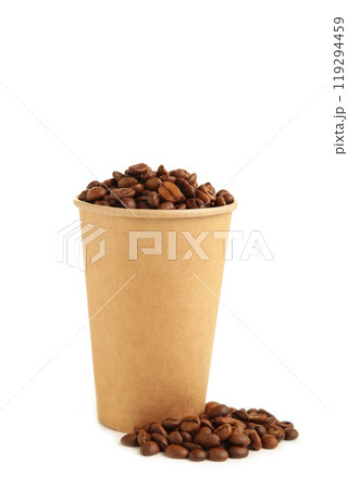 Coffee beans and paper coffee cup isolated on white background. Coffee beans and paper coffee cup isolated on white background. 119294459