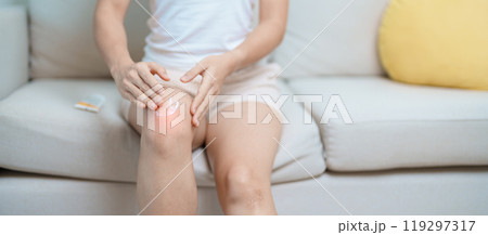 Arthritis and Muscle Pain Relief Cream concept. woman having knee ache and muscle pain due to Runners Knee or Patellofemoral Pain Syndrome, osteoarthritis, rheumatism and Patellar Tendinitis Arthritis and Muscle Pain Relief Cream concept. woman having knee ache and muscle pain due to Runners Knee or Patellofemoral Pain Syndrome, osteoarthritis, rheumatism and Patellar Tendinitis 119297317