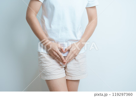 Woman hand heart shape over abdomen. Ovarian and Cervical cancer, Endometriosis, Hysterectomy, Uterine fibroids, Reproductive, menstruation, Stomach, Pregnancy and Sexual Transmitted disease concept 119297360