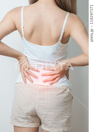 woman having back body ache during at home. adult female with muscle pain due to Piriformis Syndrome, Low Back Pain and Spinal Compression. Office syndrome and medical concept woman having back body ache during at home. adult female with muscle pain due to Piriformis Syndrome, Low Back Pain and Spinal Compression. Office syndrome and medical concept 119297371