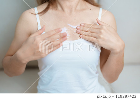 Skin care lotion and Skin body cream Moisturizing, Sunscreen and Healthy Daily Routine concepts. Beauty Woman applying moisturizing skincare cream on hand and body at home 119297422