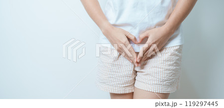 Woman hand heart shape over abdomen. Ovarian and Cervical cancer, Endometriosis, Hysterectomy, Uterine fibroids, Reproductive, menstruation, Stomach, Pregnancy and Sexual Transmitted disease concept Woman hand heart shape over abdomen. Ovarian and Cervical cancer, Endometriosis, Hysterectomy, Uterine fibroids, Reproductive, menstruation, Stomach, Pregnancy and Sexual Transmitted disease concept 119297445