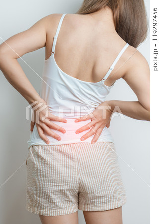 woman having back body ache during at home. adult female with muscle pain due to Piriformis Syndrome, Low Back Pain and Spinal Compression. Office syndrome and medical concept 119297456