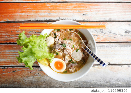 Stewed pork Noodles with egg on grunge wooden table Stewed pork Noodles with egg on grunge wooden table 119299593