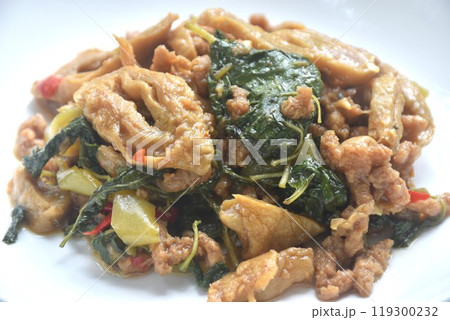 spicy stir fried chop gluten protein with basil dressing slice chili vegetarian fusion food on plate spicy stir fried chop gluten protein with basil dressing slice chili vegetarian fusion food on plate 119300232