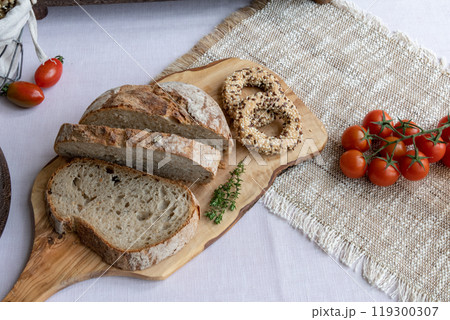 organic whole grain bread on a cutting board 119300307