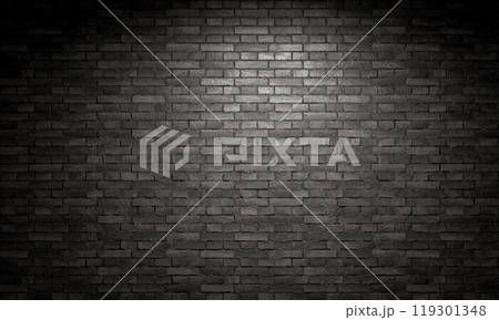 Spotlight shining on a black brick wall background 119301348