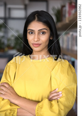 Confident Indian professional woman in casual posing for vertical portrait 119302062
