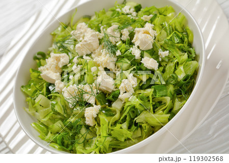 Classic Greek green lettuce salad with feta cheese Classic Greek green lettuce salad with feta cheese 119302568