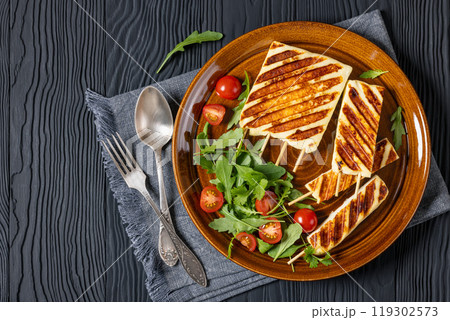 Grilled Greek Halloumi Cheese on sticks, top view Grilled Greek Halloumi Cheese on sticks, top view 119302573