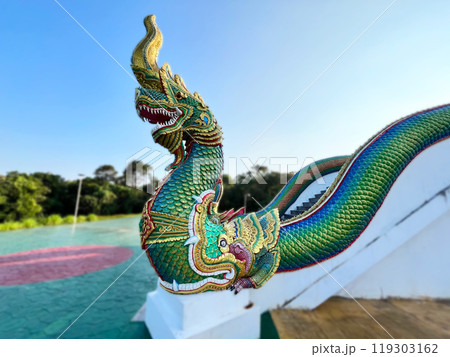 Naga King with Buddha Statue Beautiful Naga Statue, chinese dragon statue in temple, Thai dragon or serpent king statue Naga King with Buddha Statue Beautiful Naga Statue, chinese dragon statue in temple, Thai dragon or serpent king statue 119303162
