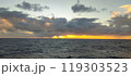 A vast expanse of water accompanied by a cloudy sky overhead 119303523