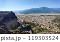 A city in a beautiful valley, surrounded by mountains 119303524