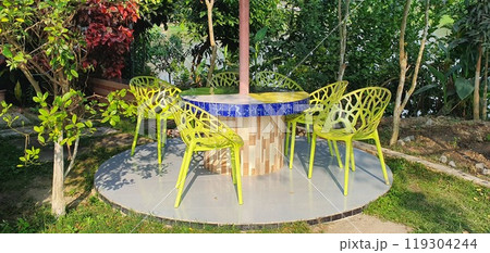 Wooden table in garden 119304244