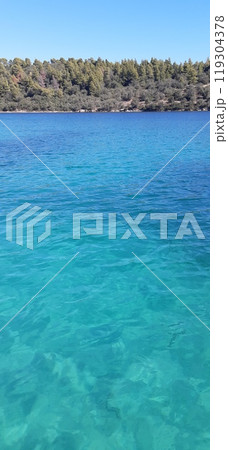Azure Aegean sea view. Vourvourou village, Diaporos island. North Greece 119304378