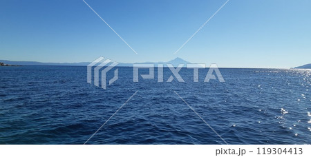 Azure Aegean sea view. Vourvourou village, Diaporos island. North Greece Azure Aegean sea view. Vourvourou village, Diaporos island. North Greece 119304413