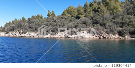 Azure Aegean sea view. Vourvourou village, Diaporos island. North Greece Azure Aegean sea view. Vourvourou village, Diaporos island. North Greece 119304414