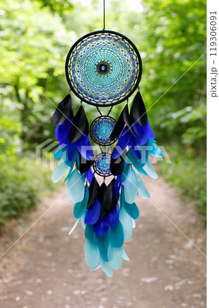 Handmade dream catcher with feathers threads and beads rope hanging Handmade dream catcher with feathers threads and beads rope hanging 119306091