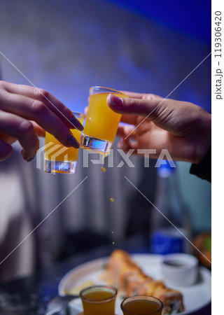 At a lively nightclub, people are enjoying wine and socializing in a chic ambiance At a lively nightclub, people are enjoying wine and socializing in a chic ambiance 119306420