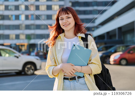 Young female college student with digital tablet, outdoors Young female college student with digital tablet, outdoors 119306726