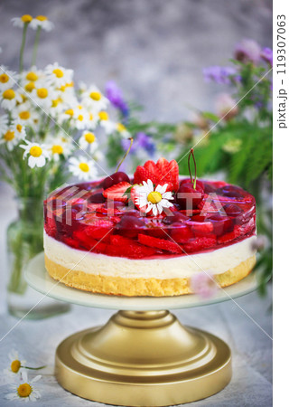 Delicious strawberry cake with vanilla sponge, cream mousse, jelly and fresh berries Delicious strawberry cake with vanilla sponge, cream mousse, jelly and fresh berries 119307063