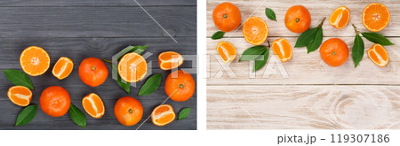 tangerine with leaves on black and white wooden background with copy space for your text. Flat lay, top view. Fruit composition tangerine with leaves on black and white wooden background with copy space for your text. Flat lay, top view. Fruit composition 119307186
