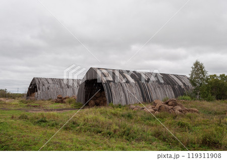 Hangars with bales of hay Hangars with bales of hay 119311908