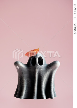 Ghost figure topped with autumn colored leaf. Artistry and seasonal themes. Ghost figure topped with autumn colored leaf. Artistry and seasonal themes. 119313204