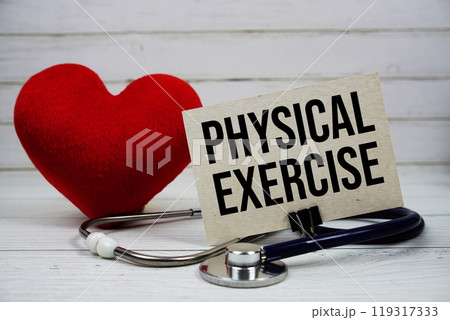 Physical Exercise text message on paper card with stethoscope on wooden background 119317333