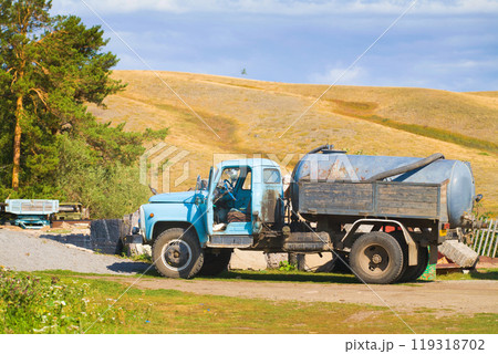 Auto cistern truck GAZ in work in village 119318702