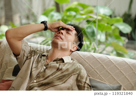 Man Having Headache After Working Day 119321840