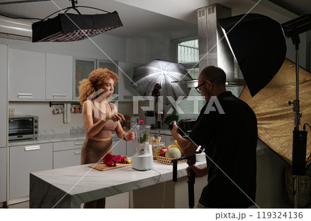 Cameraman Shooting Video With Model Cameraman Shooting Video With Model 119324136