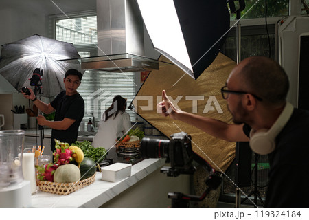 Operator Setting Camera With His Colleague Operator Setting Camera With His Colleague 119324184