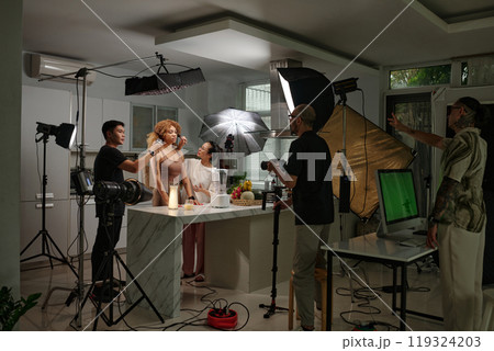 Cameraman Shooting Model In Studio Cameraman Shooting Model In Studio 119324203