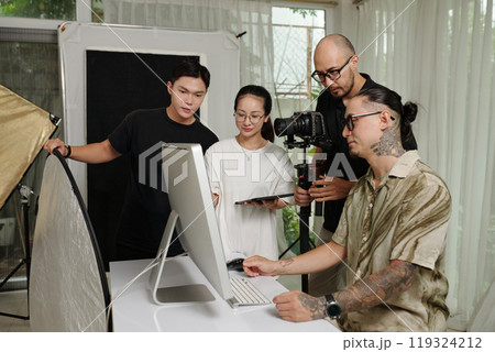 Crew Using Computer To Plan The Shoot Crew Using Computer To Plan The Shoot 119324212