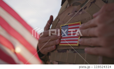 American Soldier With Flag On His Chest Of The United States During Memorial Day American Soldier With Flag On His Chest Of The United States During Memorial Day 119324314