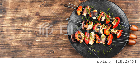 A plate of octopus skewers. A plate of octopus skewers. 119325451