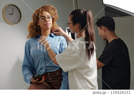 Assistant Preparing Model Before Shooting Assistant Preparing Model Before Shooting 119326131