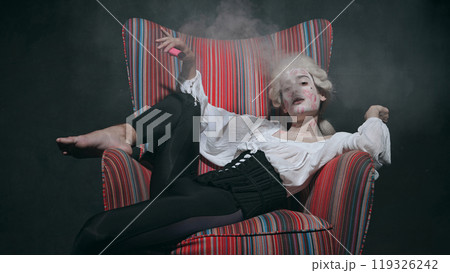 Surrounded by smoke, medieval person with kiss marks smokes, blending historical costume with modern vice. 119326242