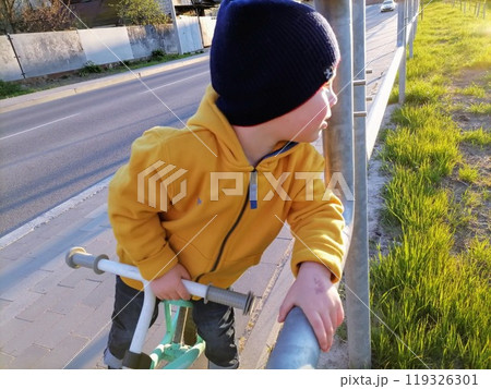 Adorable toddler boy having fun on playground 119326301