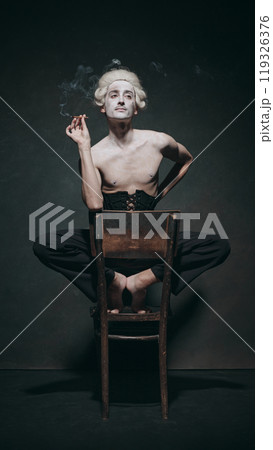 Historical male character smokes with exaggerated elegance, embodying odd blend of classical indulgence and modern surrealist energy. 119326376