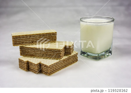 A glass of yogurt and wafers with chocolate filling 119328162