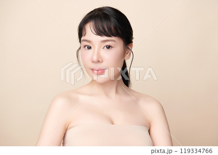 Beautiful young asian woman with clean fresh skin on beige background, Face care, Facial treatment, Cosmetology, beauty and spa, Asian women portrait. 119334766