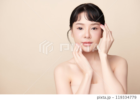 Beautiful young asian woman with clean fresh skin on beige background, Face care, Facial treatment, Cosmetology, beauty and spa, Asian women portrait. Beautiful young asian woman with clean fresh skin on beige background, Face care, Facial treatment, Cosmetology, beauty and spa, Asian women portrait. 119334779